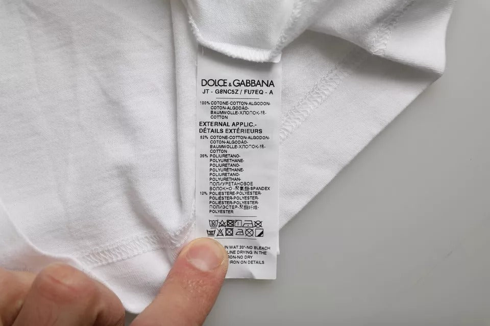White cotton Dolce & Gabbana men's casual T-shirt with DG applique design, short sleeves and round neckline.