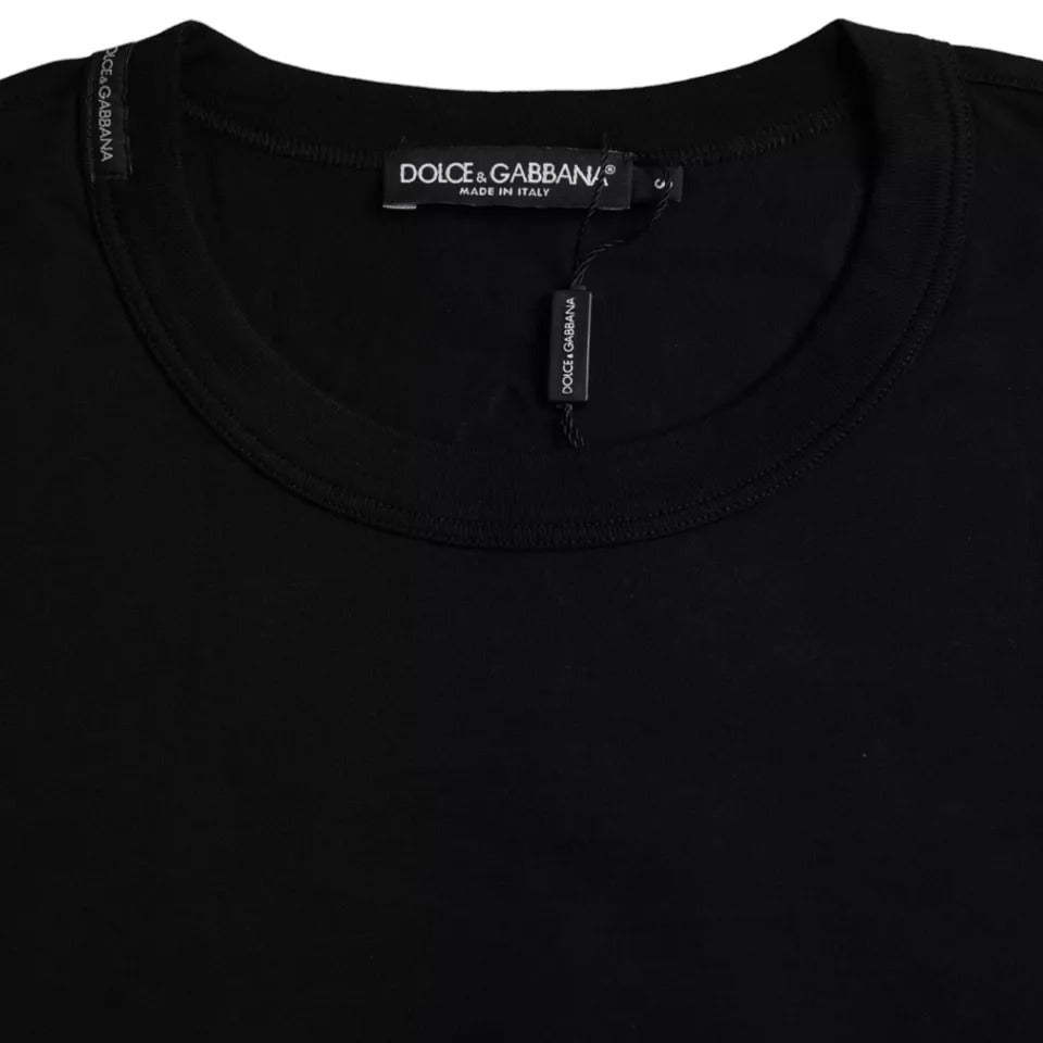 Black cotton crew neck T-shirt with embossed Dolce & Gabbana logo on chest, casual style, made of soft, comfortable fabric.