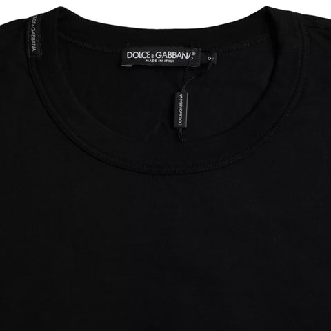 Black cotton crew neck T-shirt with embossed Dolce & Gabbana logo on chest, casual style, made of soft, comfortable fabric.