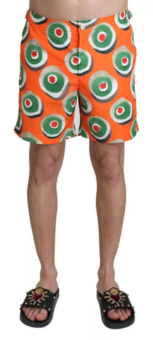 Orange cupcake print Dolce & Gabbana beachwear shorts with swimwear design, featuring a vibrant and playful pattern.