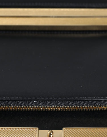 Multicolor floral gold frame clutch evening purse bag by Dolce & Gabbana with vibrant floral design and elegant gold frame.