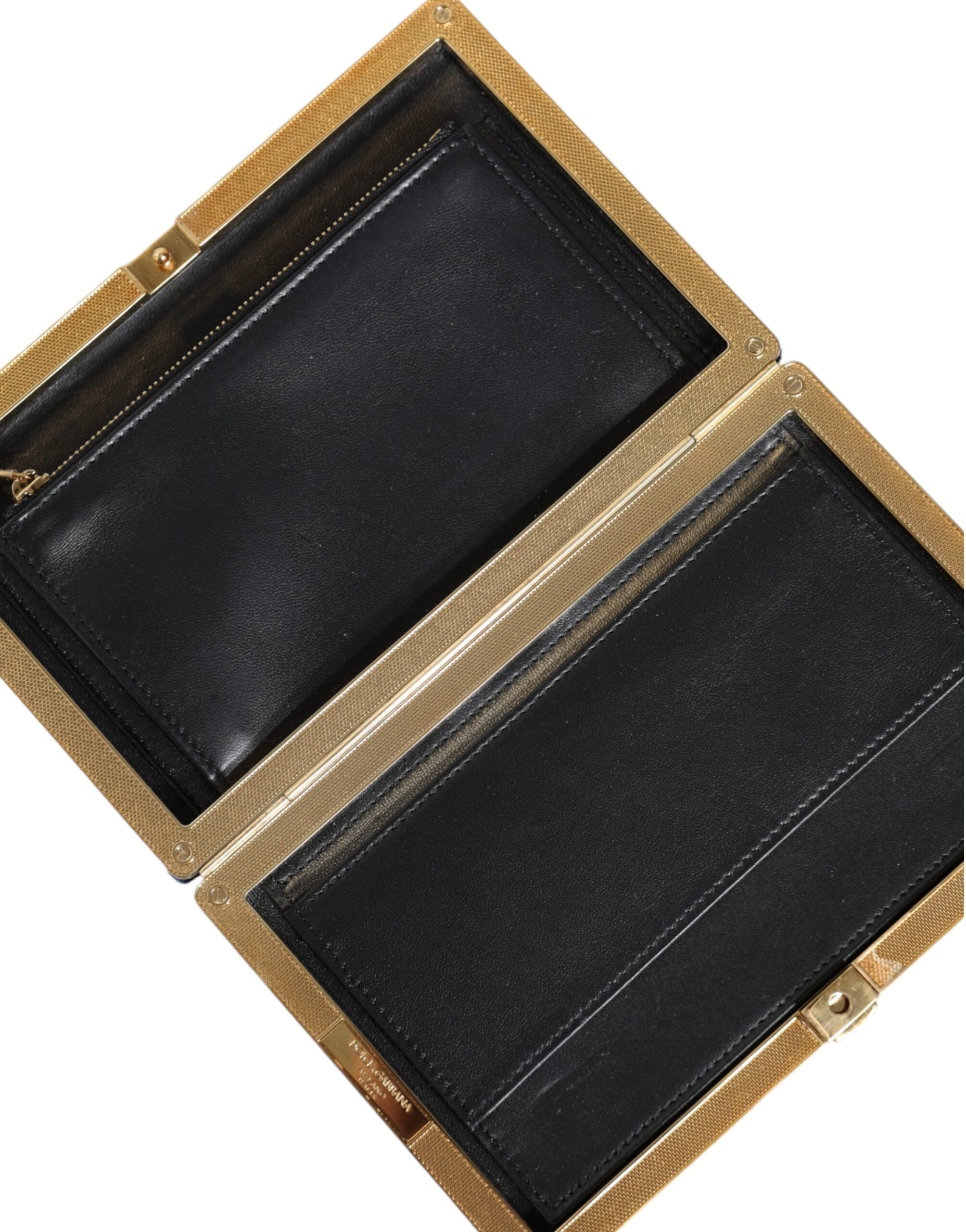 Blue velvet clutch purse with gold frame, elegant evening party bag by Dolce & Gabbana, featuring a sleek, luxurious design.