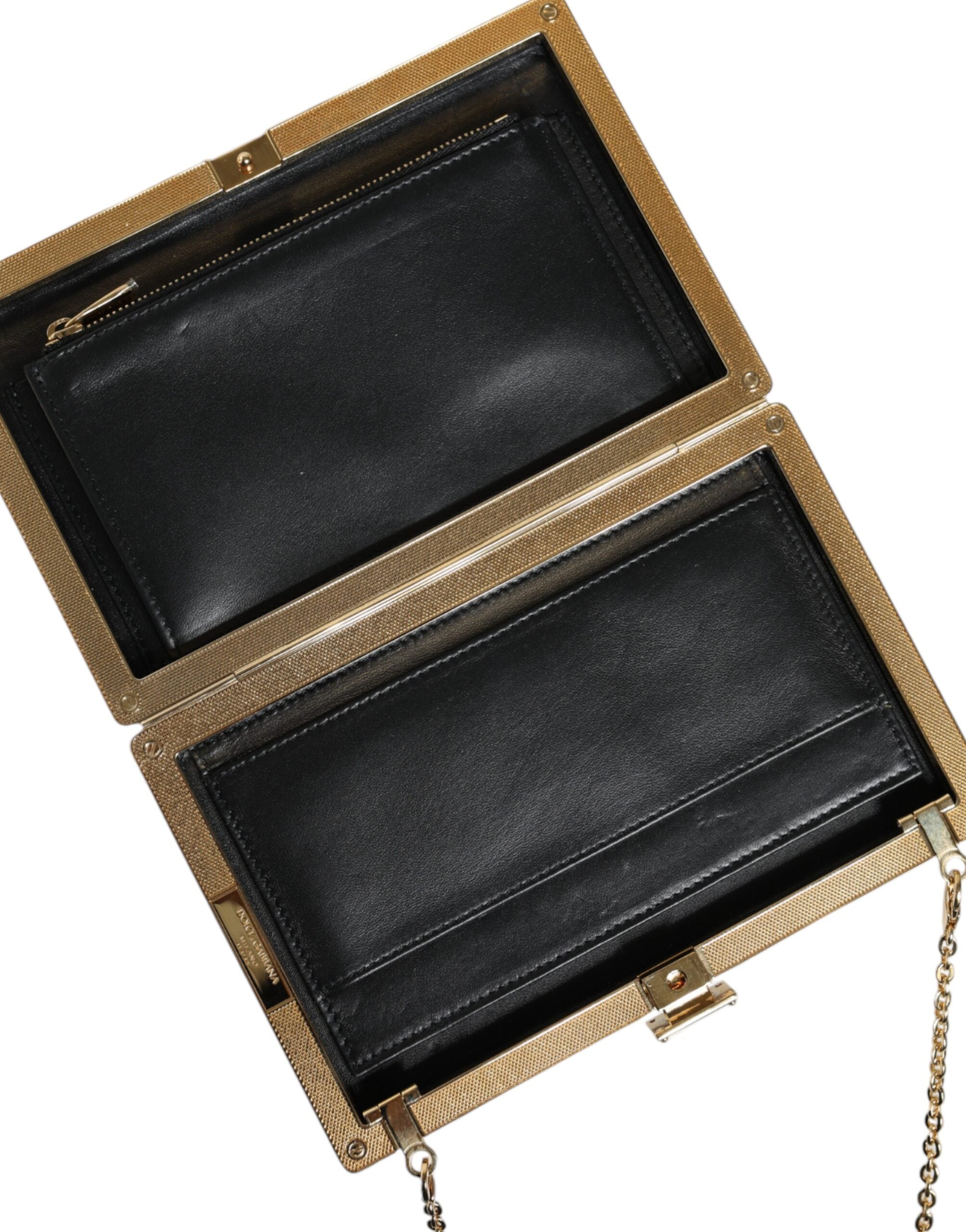 Brown leather Dolce & Gabbana mini clutch crossbody bag with gold frame and compact design.