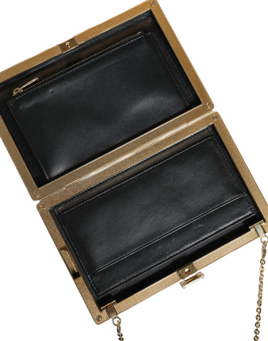 Brown leather Dolce & Gabbana mini clutch crossbody bag with gold frame and compact design.