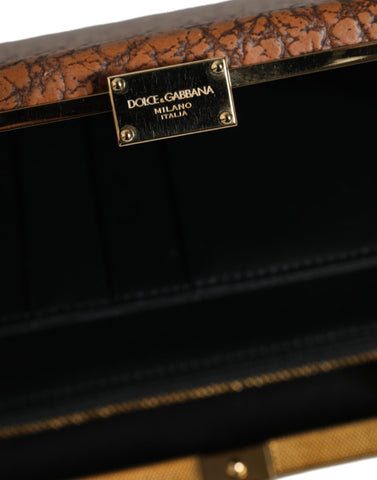 Brown leather mini crossbody clutch bag with gold frame from Dolce & Gabbana, featuring a sleek, compact design and elegant detailing.