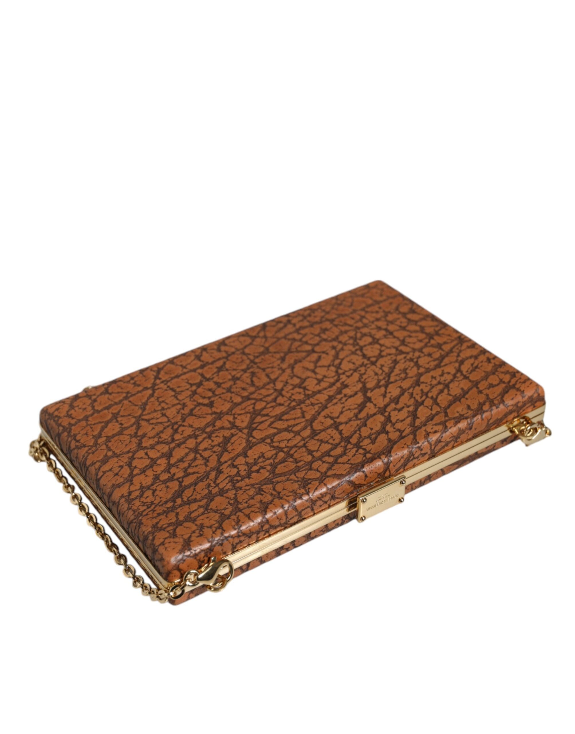 Brown leather Dolce & Gabbana clutch with gold frame, mini crossbody bag showing its compact and elegant design.