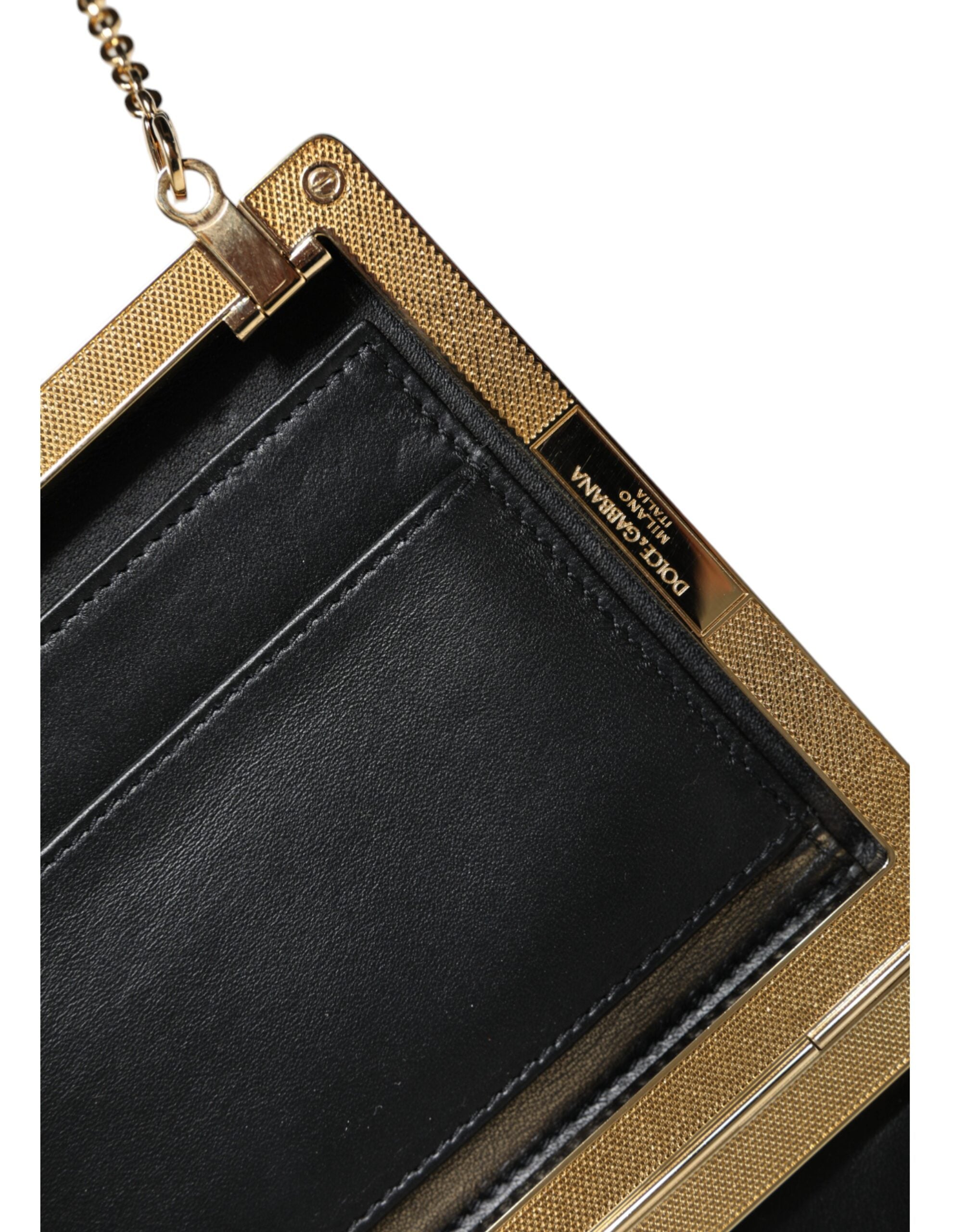 Brown leather Dolce & Gabbana mini crossbody clutch with gold frame and compact design, featuring a sleek, elegant look.