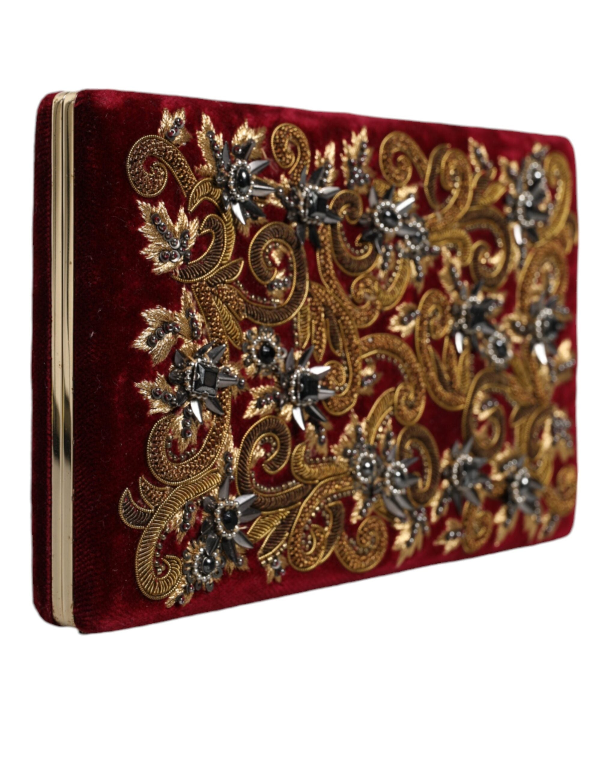 Red velvet Dolce & Gabbana clutch bag with gold frame, suitable for evening parties and elegant events.