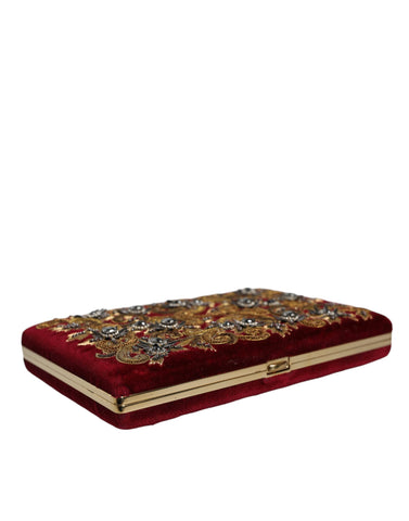 Red velvet clutch purse with gold frame, Dolce & Gabbana evening party bag featuring elegant design and compact size.