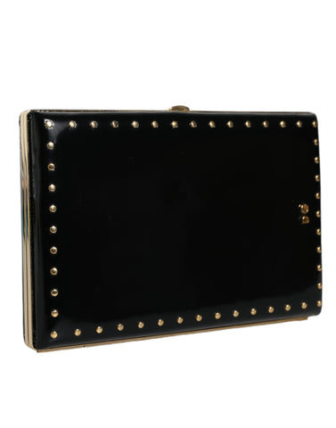 Black leather clutch purse with gold frame and stud accents, designed by Dolce & Gabbana for evening occasions.