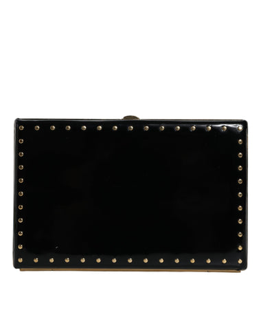 Black leather clutch purse with gold frame and stud details, ideal for evening events, by Dolce & Gabbana.