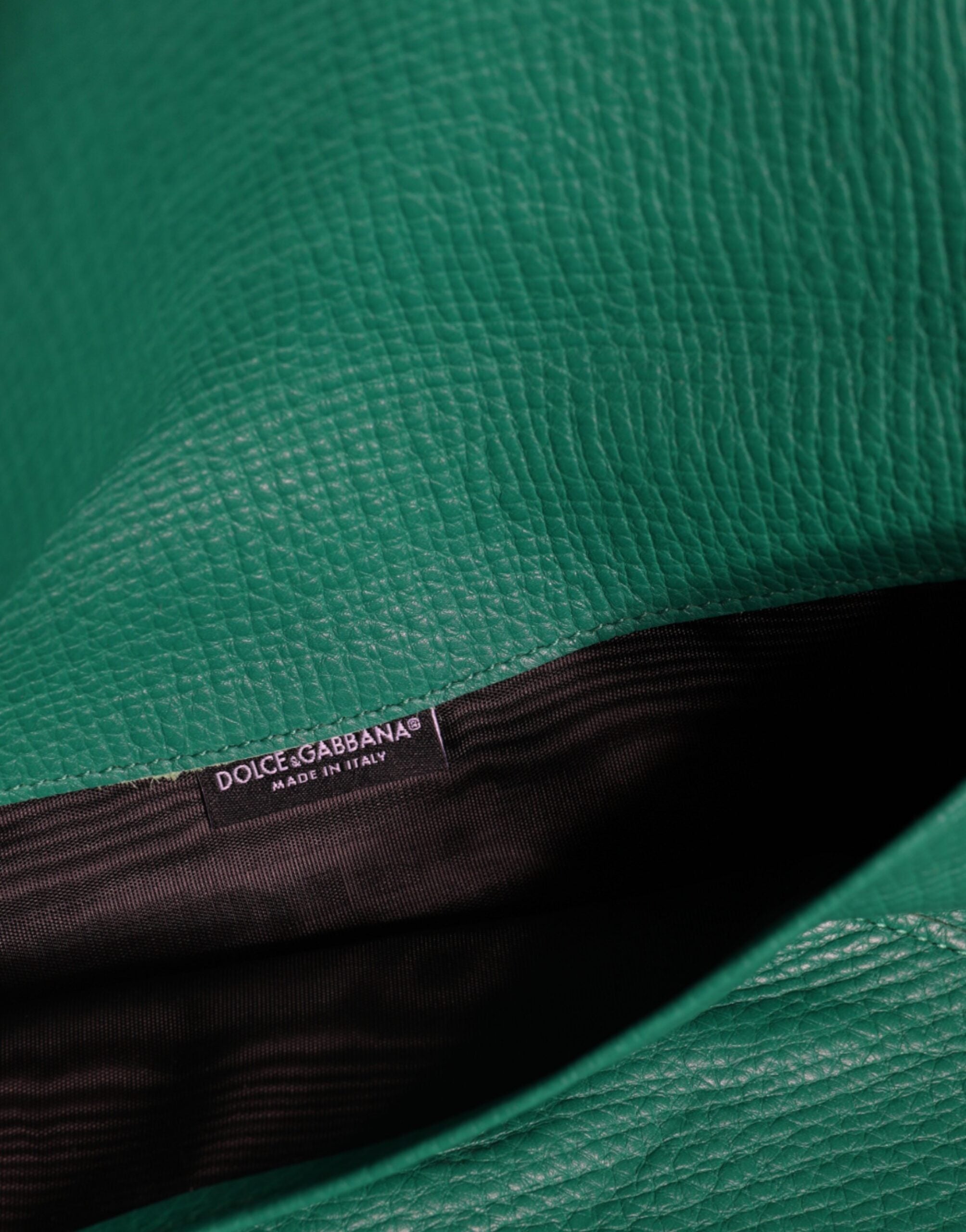 Green leather Dolce & Gabbana mini clutch purse with pouch design, suitable as a tablet case or small handbag accessory.