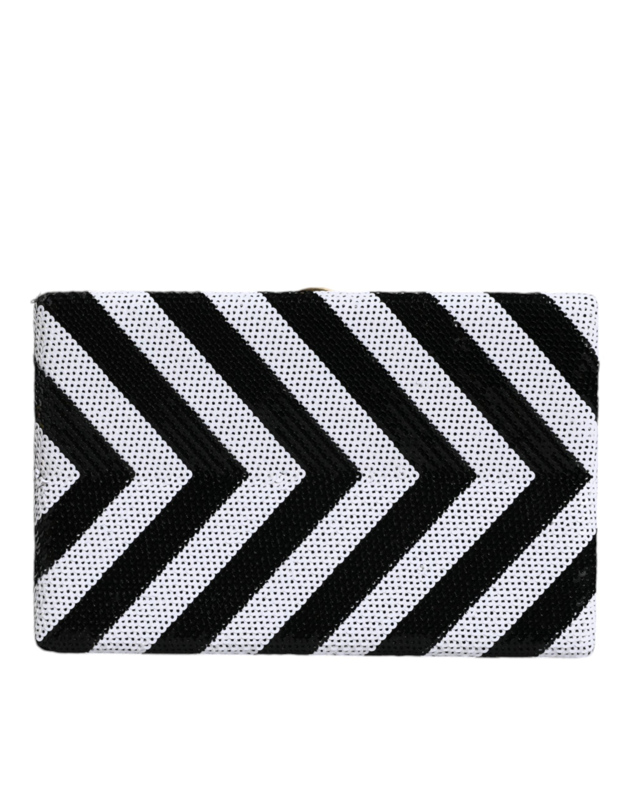 Black and white gold frame clutch purse by Dolce & Gabbana, featuring a sleek evening party design with elegant gold accents.