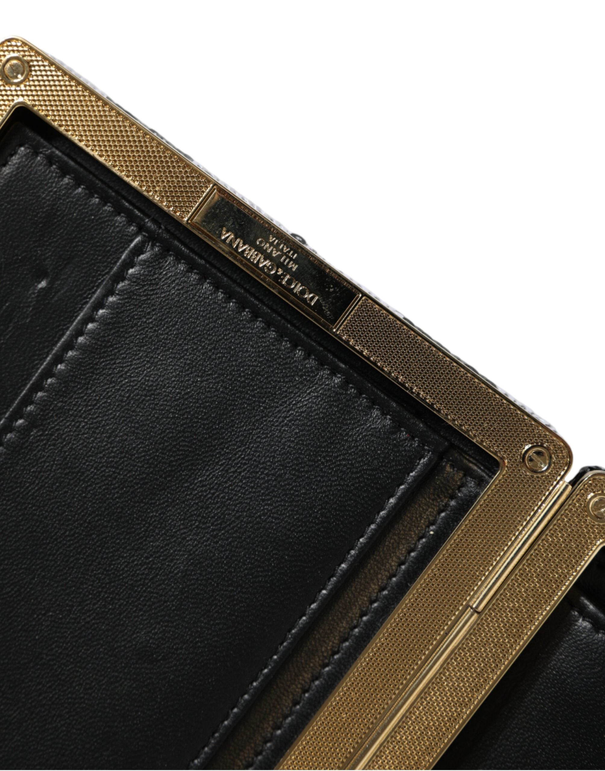 Dolce & Gabbana black and white gold frame clutch purse for evening parties, featuring elegant design and structured style.