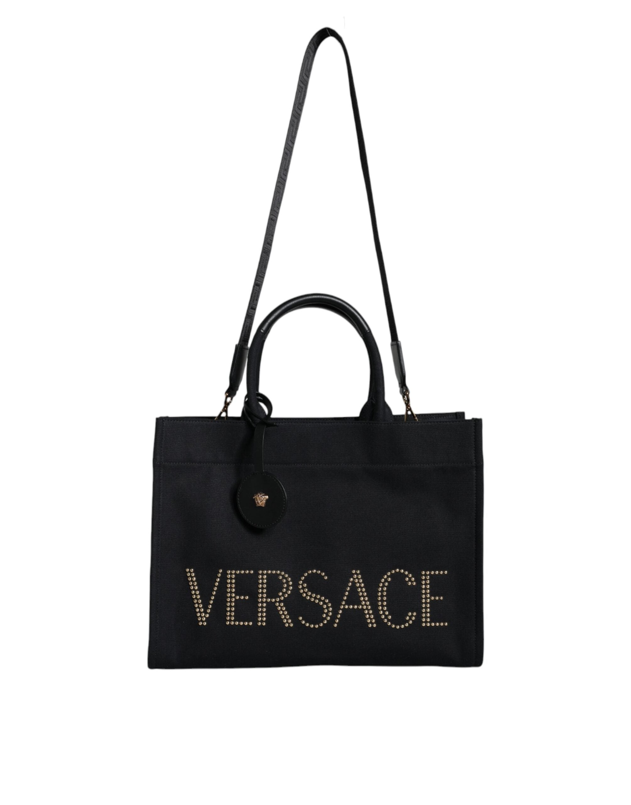 Versace black canvas and leather crossbody tote bag with top handle and logo detail, stylish and functional for everyday use.