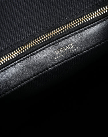 Versace black top handle canvas and leather logo crossbody tote bag with spacious interior and sturdy straps.