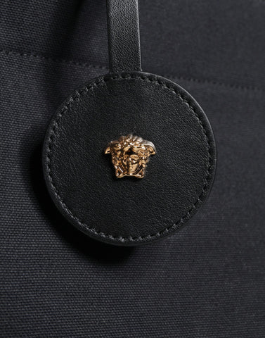Versace black canvas leather logo crossbody tote bag with top handle, stylish and spacious for everyday use.