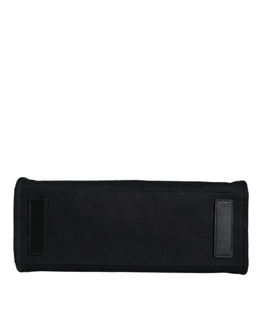 Black Versace top handle canvas and leather crossbody tote bag with logo, featuring a spacious design and sturdy handles.