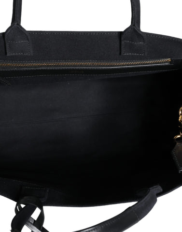 Versace black crossbody tote bag with top handle, canvas and leather construction, featuring the iconic logo.