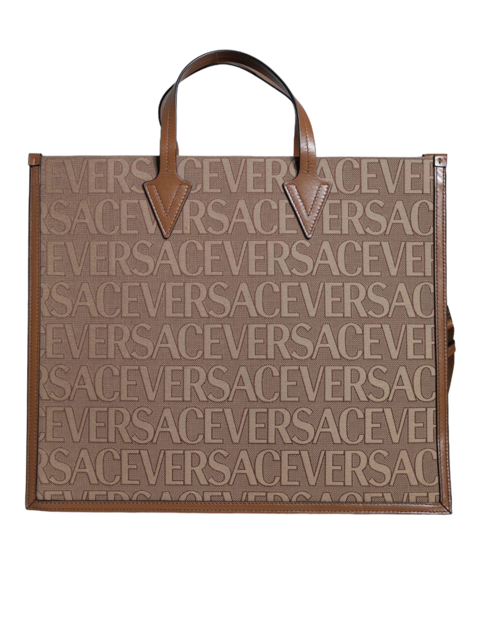 Brown Versace leather crossbody tote bag with top handle, jacquard pattern, and logo detailing.