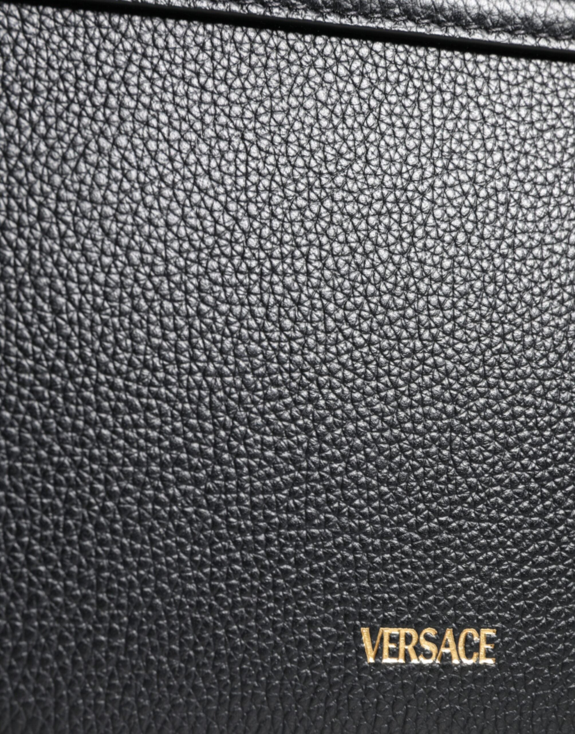 Black grainy calf leather Versace logo crossbody shoulder bag, stylish and compact with adjustable strap and iconic branding.