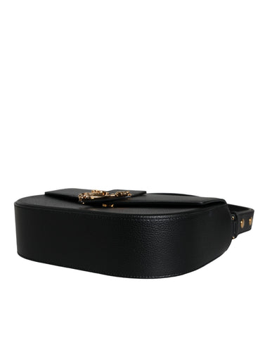 Black grainy calf leather Versace logo crossbody shoulder bag with sleek design and adjustable strap.