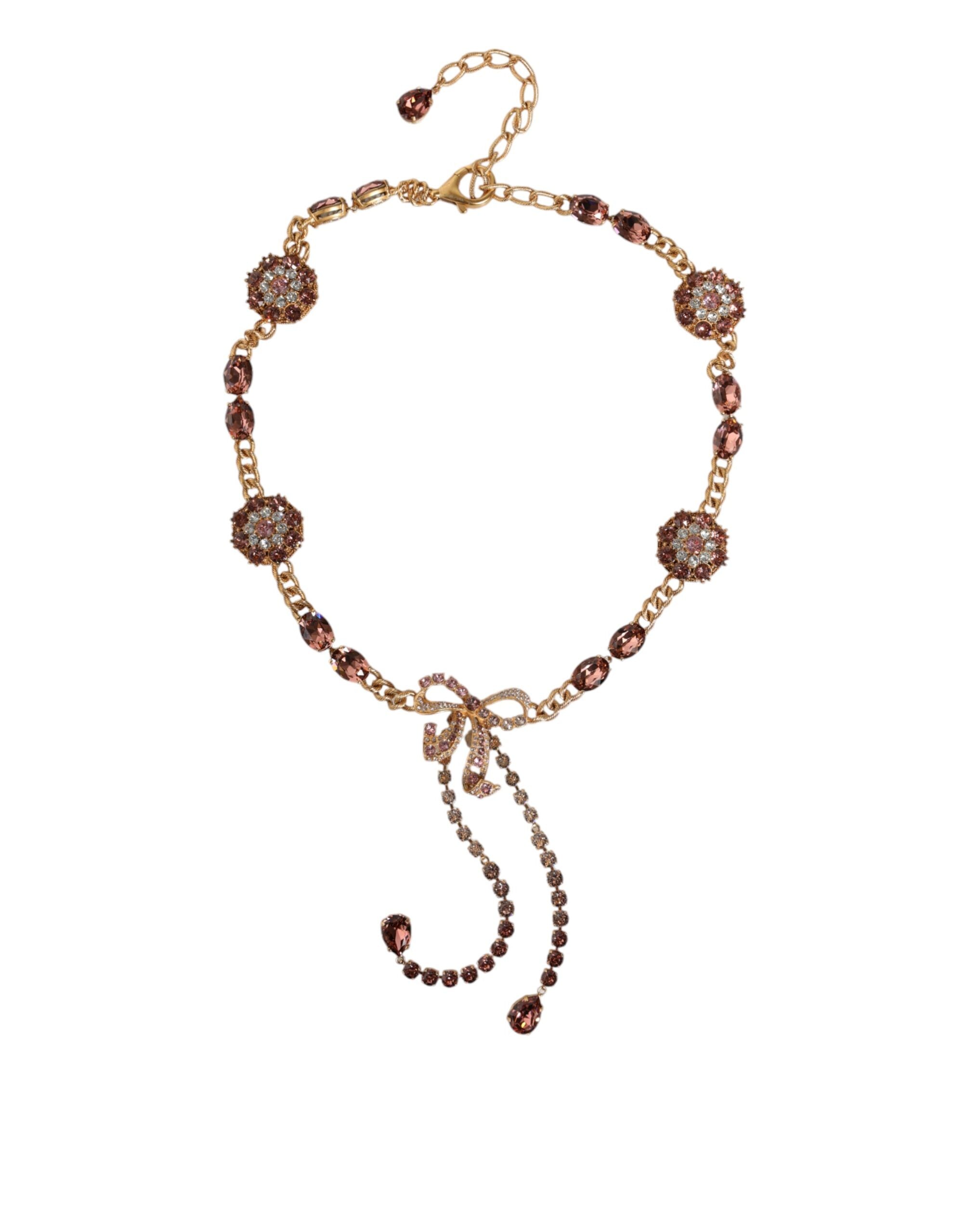 Gold tone brass waist chain belt with crystal embellishments by Dolce & Gabbana, featuring intricate detailing and a stylish design.