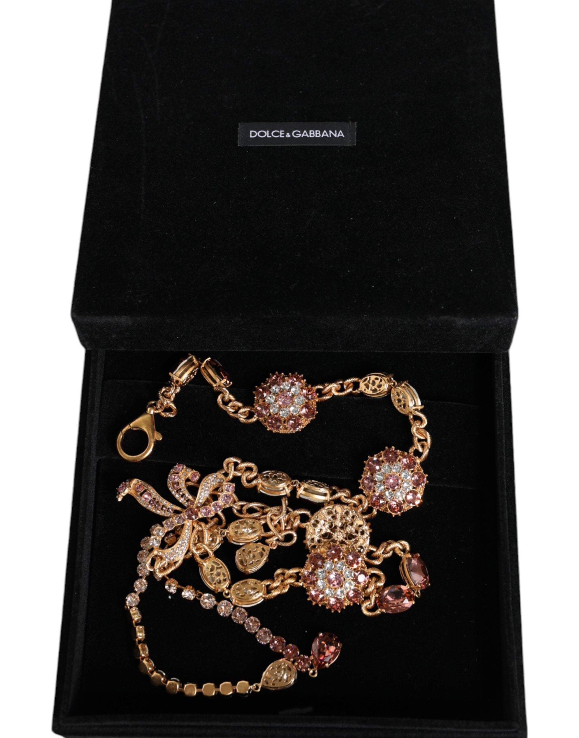 Gold tone brass waist chain belt with crystal embellishments by Dolce & Gabbana, featuring intricate detailing and a luxurious finish.