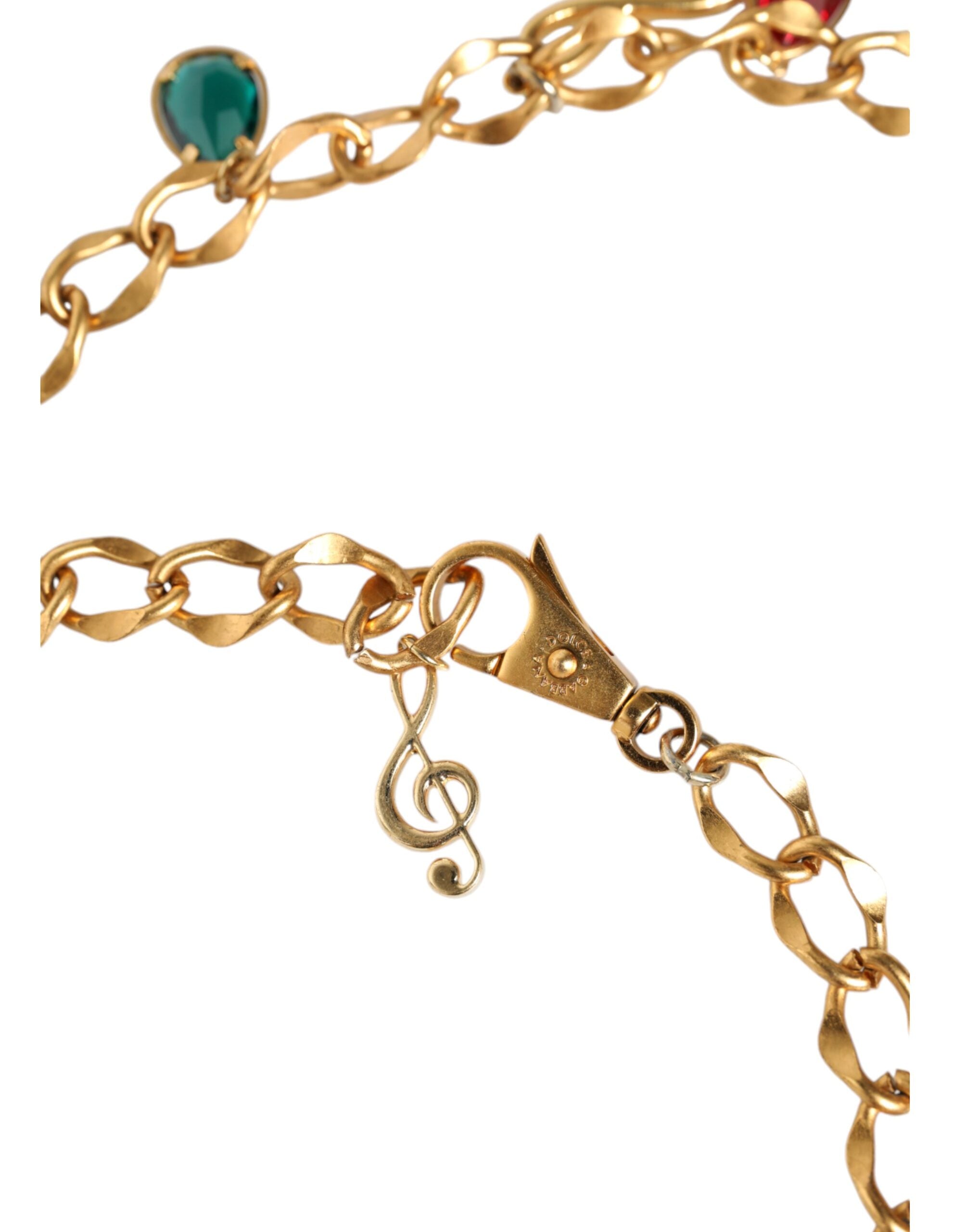 Gold tone brass waist chain belt with fruity crystal embellishments from Dolce & Gabbana, featuring intricate design and sparkling accents.