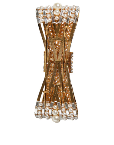 Gold tone brass bow brooch with crystal accents and faux pearl embellishments, designed by Dolce & Gabbana.