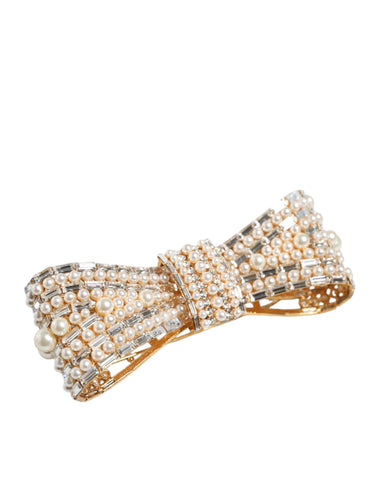 Gold tone brass bow brooch with crystal and faux pearl embellishments, Dolce & Gabbana jewelry accessory.