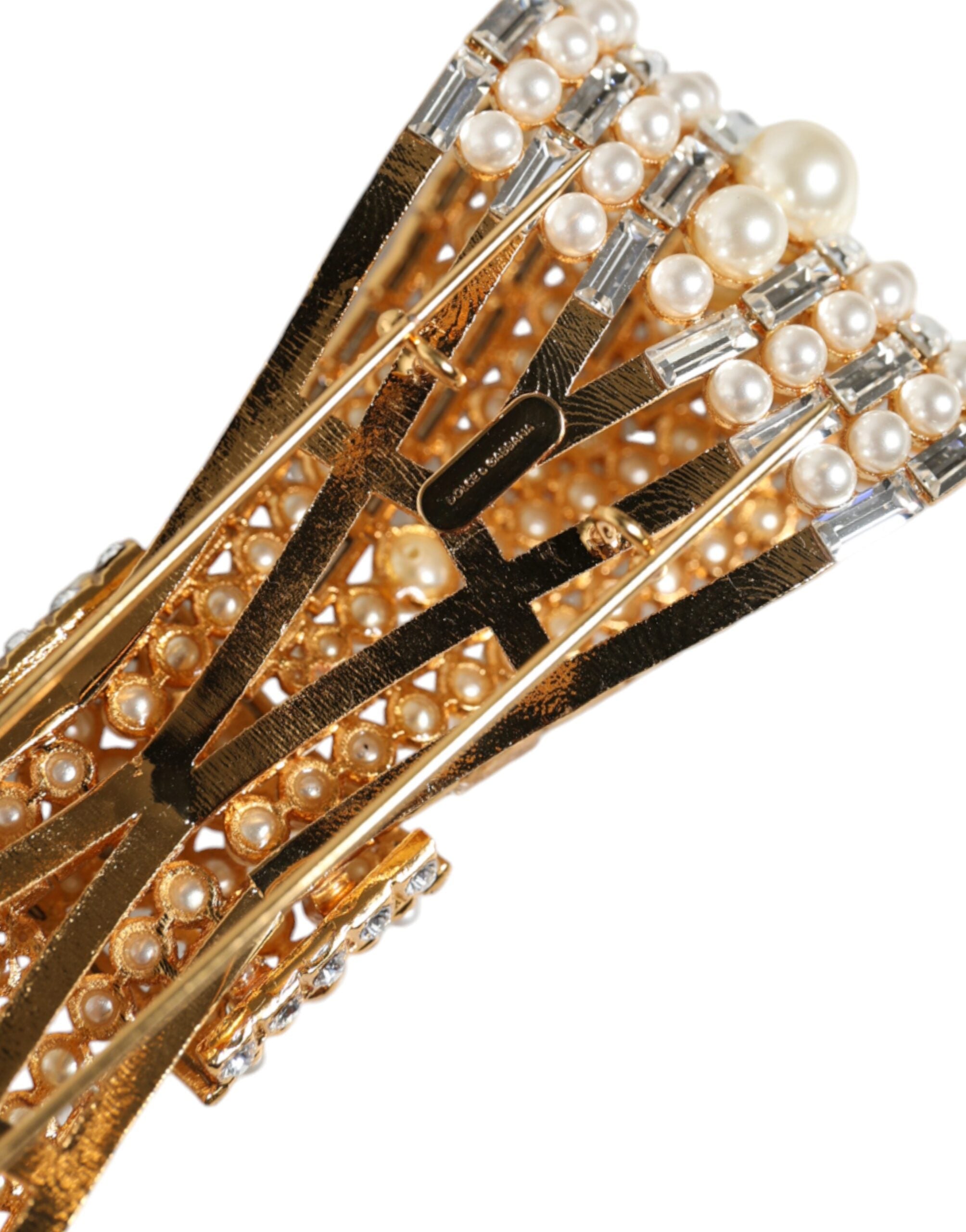 Gold tone brass brooch with crystal embellishments and faux pearl accents, designed by Dolce & Gabbana.