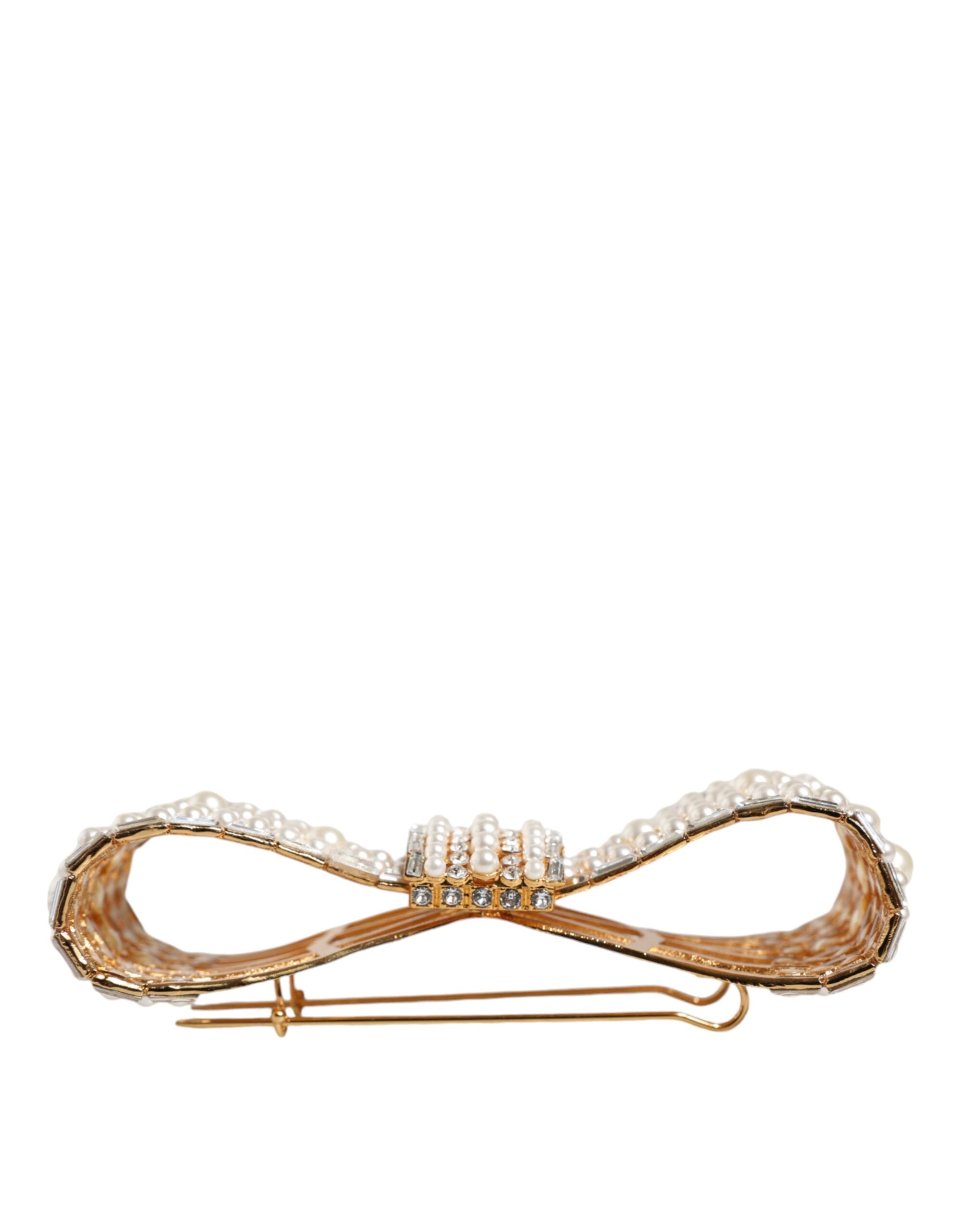 Gold tone brass bow brooch with crystal and faux pearl embellishments, designed by Dolce & Gabbana.