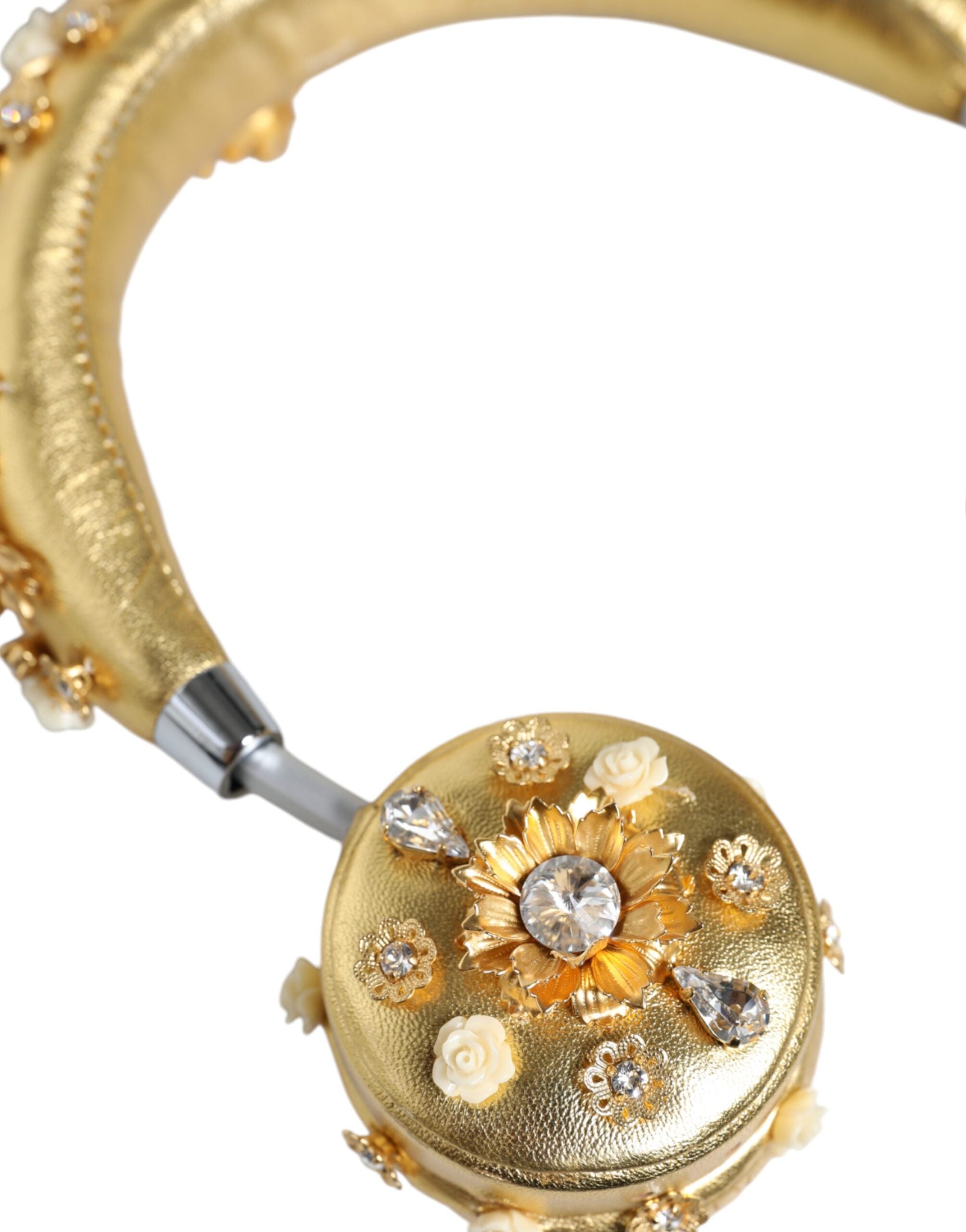 Gold leather floral crystal angel-shaped headset headphones by Dolce & Gabbana with intricate floral details and crystal accents.