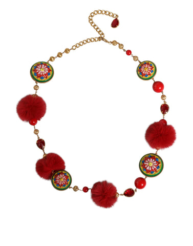 Gold brass waist belt with red fur and crystal accents, designed by Dolce & Gabbana, featuring a bold, decorative torero style.