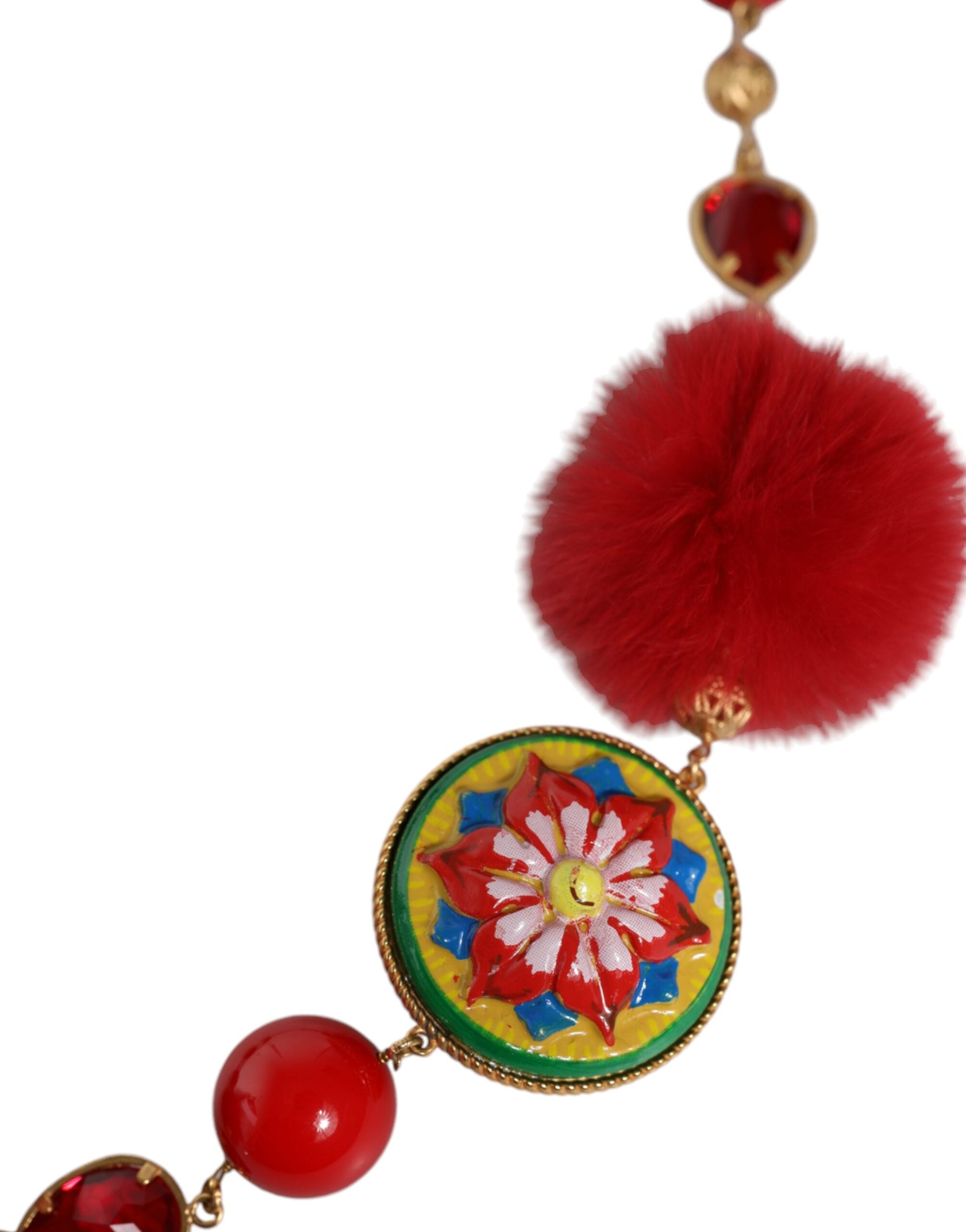 Gold brass waist belt with red fur and crystal accents, designed by Dolce & Gabbana, featuring a bold torero style.