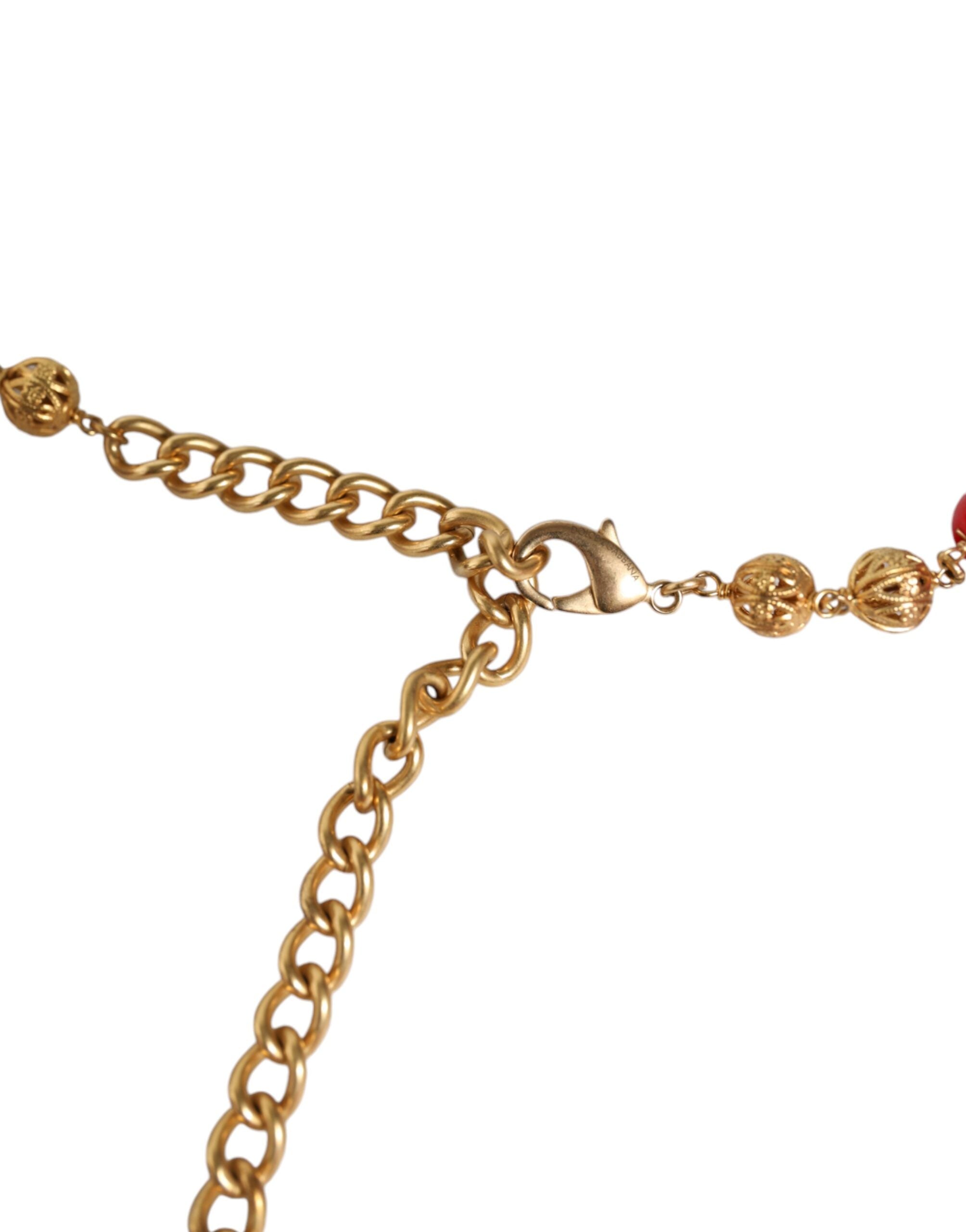 Gold brass waist belt with red fur and crystal accents by Dolce & Gabbana, featuring a torero-inspired design.