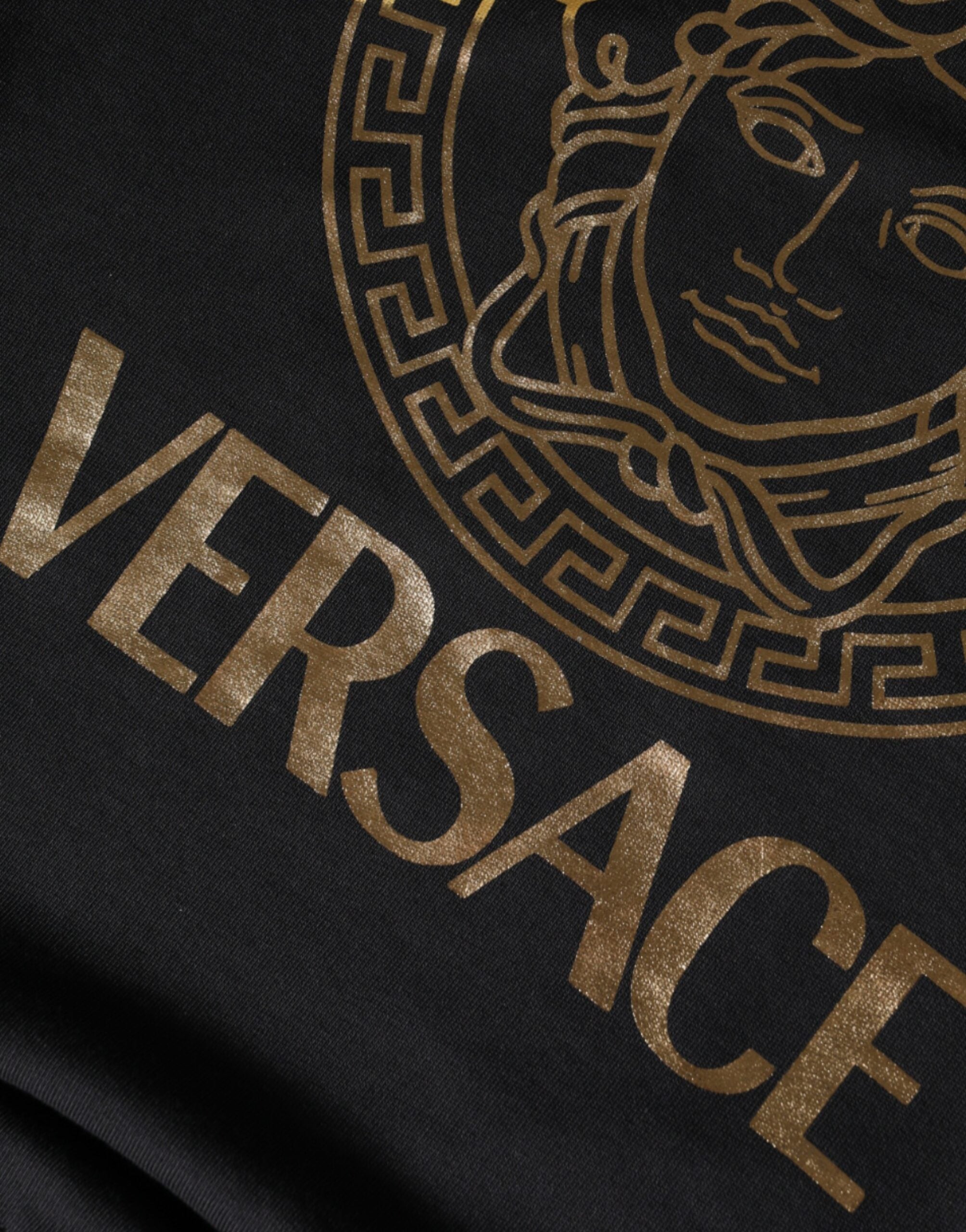Black Medusa fleece cotton crew neck sweatshirt by Versace, featuring Medusa design on the front, casual and stylish.