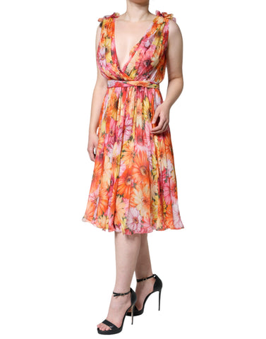 Multicolor floral sleeveless V-neck midi dress by Dolce & Gabbana, featuring vibrant patterns and elegant design.