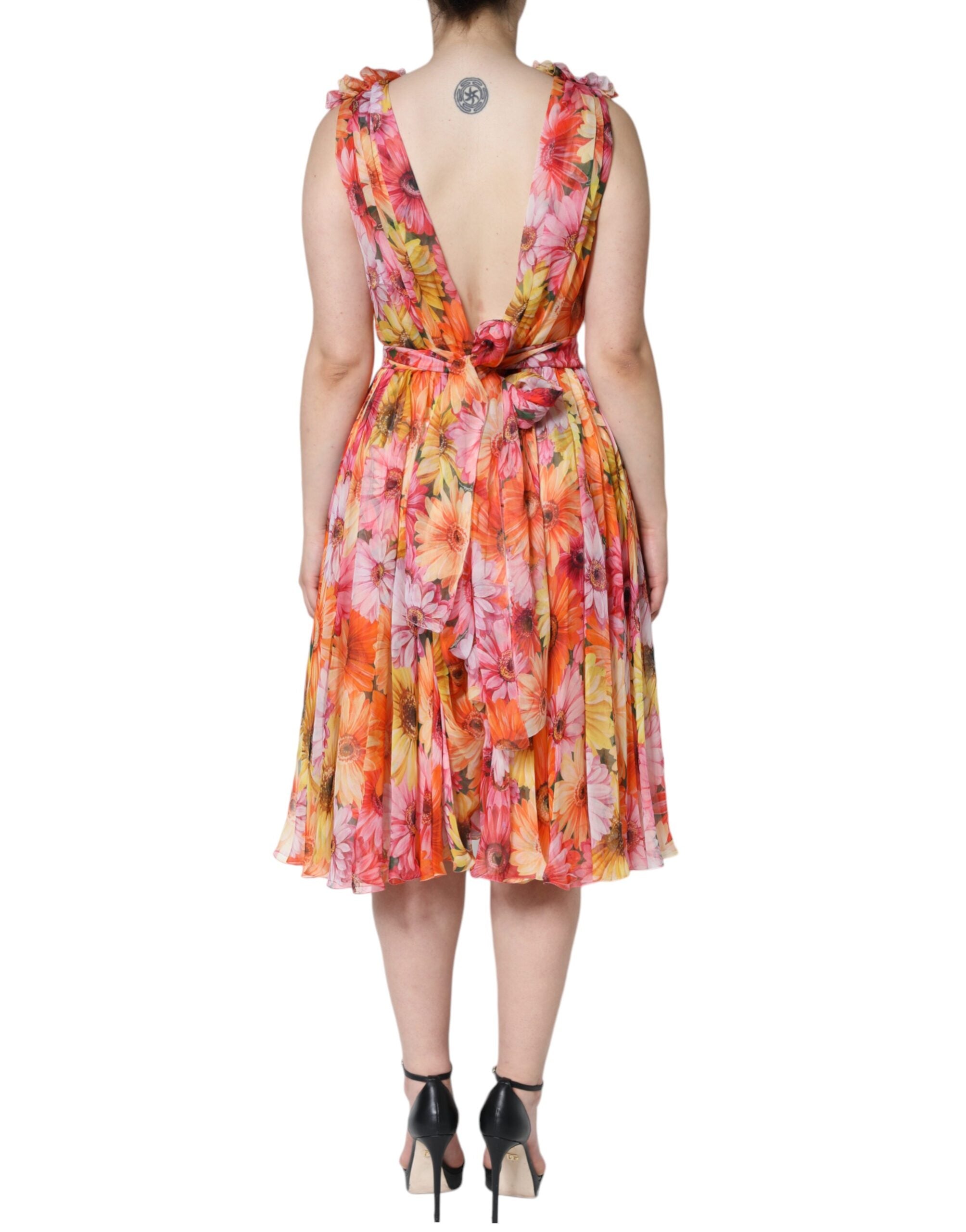 Dolce & Gabbana multicolor floral sleeveless V-neck midi dress displayed on a hanger with vibrant pattern details.