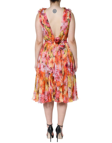 Dolce & Gabbana multicolor floral sleeveless V-neck midi dress displayed on a hanger with vibrant pattern details.