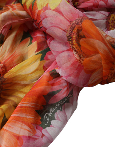 Multicolor floral sleeveless V-neck midi dress by Dolce & Gabbana, shown on a model.