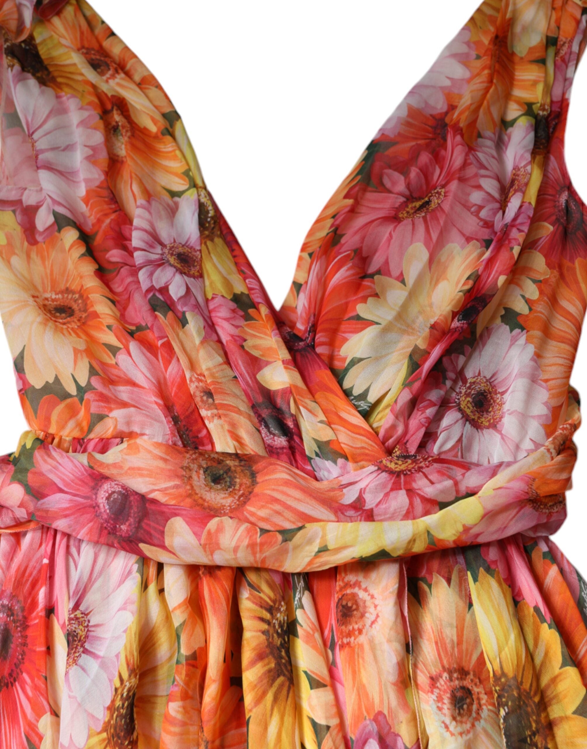 Dolce & Gabbana multicolor floral sleeveless V-neck midi dress hanging on a mannequin, showcasing vibrant floral patterns and elegant design.