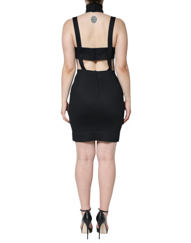 Black cut-out sleeveless bodycon mini dress by Dolce & Gabbana, shown on a model with a fitted silhouette and stylish design.