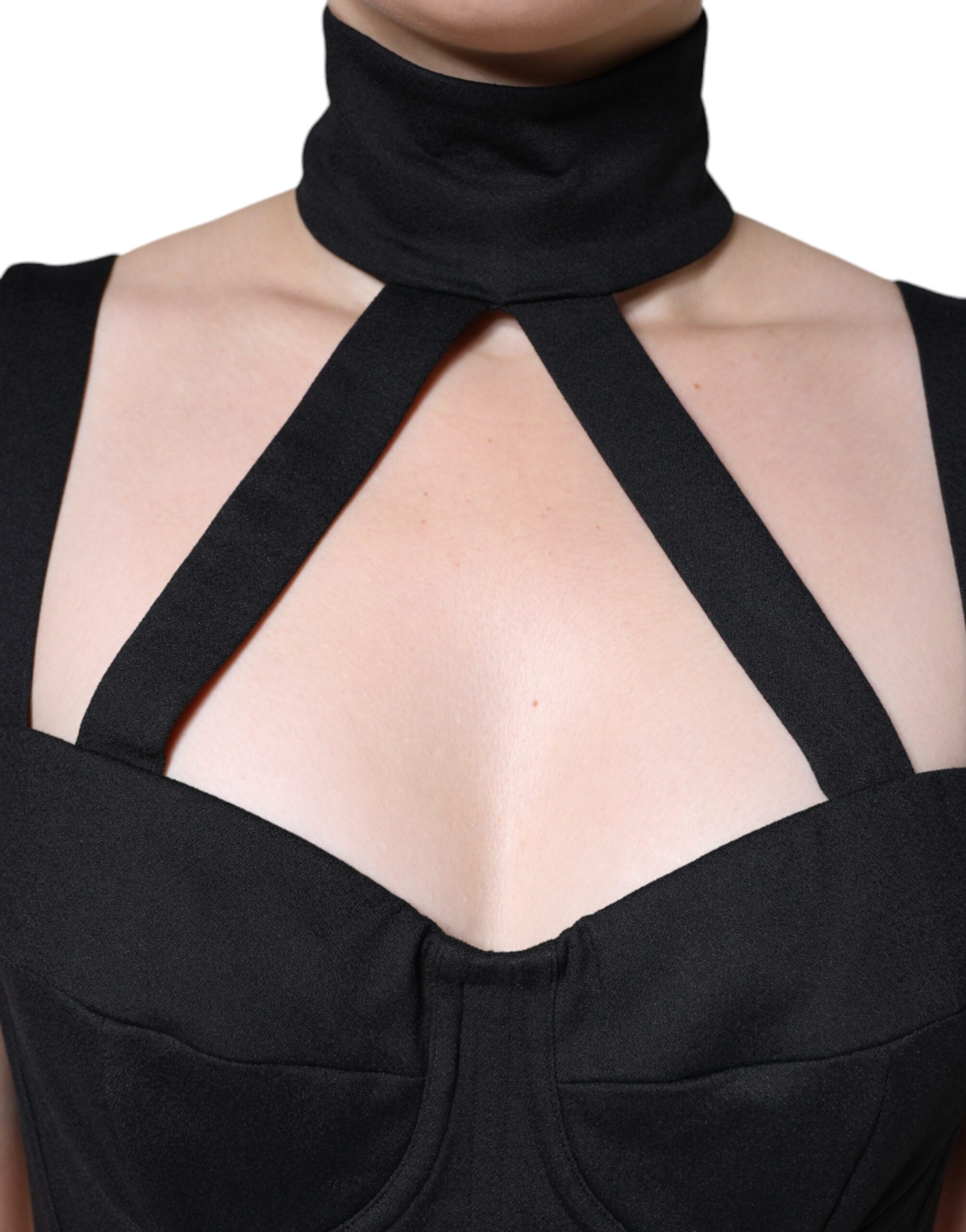 Black cut-out sleeveless bodycon mini dress by Dolce & Gabbana, featuring a fitted silhouette and stylish design.
