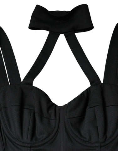 Black cut-out sleeveless bodycon mini dress by Dolce & Gabbana, shown on a model with a fitted silhouette and stylish design.