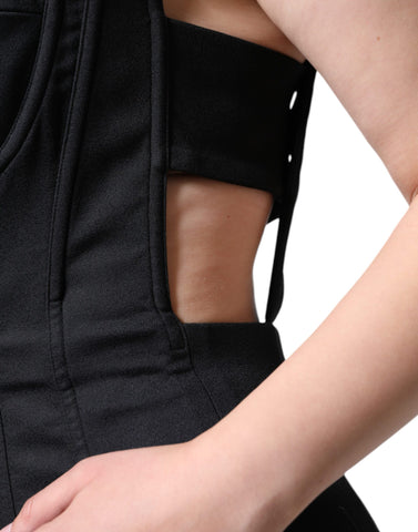 Black cut-out sleeveless bodycon mini dress by Dolce & Gabbana, form-fitting with stylish cut-out details.