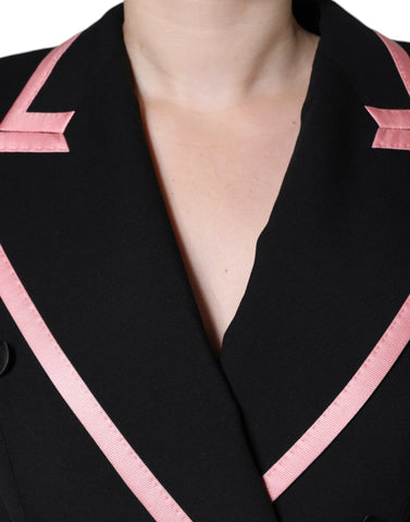 Black wool blend sleeveless jumpsuit dress by Dolce & Gabbana displayed on a hanger.