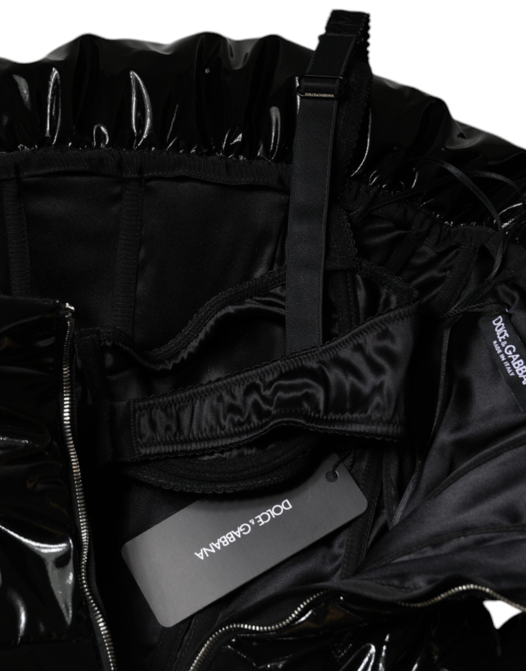 Black polyester ruched coated mini dress by Dolce & Gabbana, shown with fitted silhouette and textured fabric details.