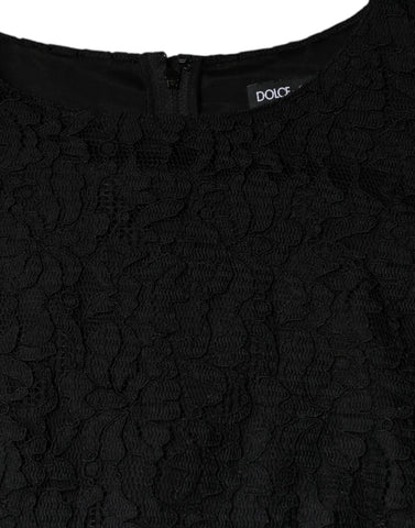 Black floral lace sheath sleeveless mini dress by Dolce & Gabbana, showcasing intricate lace details and a fitted silhouette.